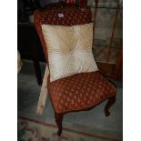 A French style Queen Anne leg bedroom chair.