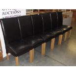 A set of 6 high back leather dining chairs