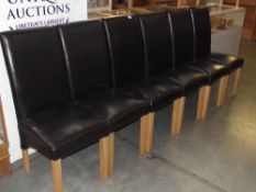 A set of 6 high back leather dining chairs