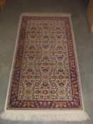 An Eastern wool rug size 61 x 160 cm