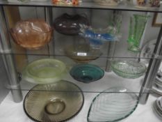 A large quantity of coloured glass dishes etc.