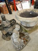 2 concrete garden ornaments and a jardiniere planter.