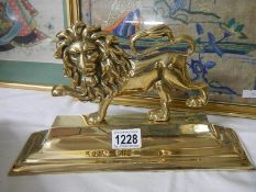 A good polished brass lion doorstop.
