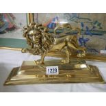 A good polished brass lion doorstop.