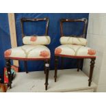 A pair of bedroom chairs.