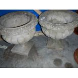 A pair of garden urns.