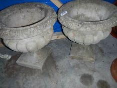 A pair of garden urns.