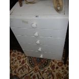 An old white 3 drawer chest.