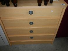 A nest of 3 oak tables.