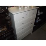 A white finished pine bedroom chest of drawers