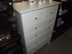 A white finished pine bedroom chest of drawers