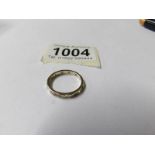 A 9ct gold eternity ring, white stone set, dated Birmingham 1989, full hoop, size M, 2 grams.