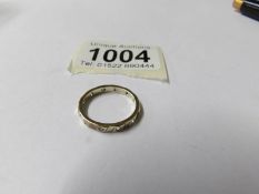 A 9ct gold eternity ring, white stone set, dated Birmingham 1989, full hoop, size M, 2 grams.