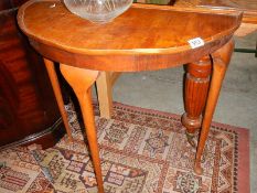 A mahogany D shaped hall table.