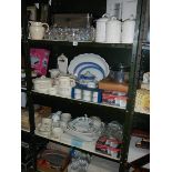 4 shelves of kitchen ware including some new items.