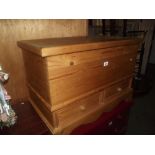 A solid pine blanket box with 2 drawers