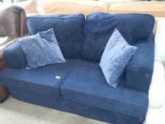 A Royal blue 2 seater sofa.