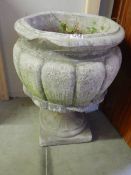 A bulbous flower garden urn.