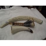 A resin elephant tusk ornament & 2 cow horn musical instruments