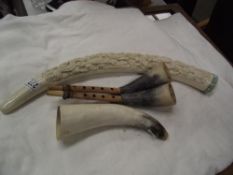 A resin elephant tusk ornament & 2 cow horn musical instruments