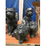 4 dog garden ornaments.