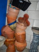 A large quantity of plastic and other pots.