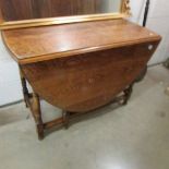 A 1920's oak gate leg table.