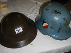 2 old helmets, one being German.