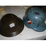 2 old helmets, one being German.