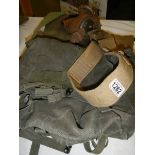 An army gas mask, holster etc.