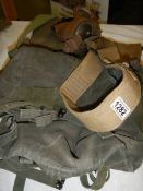 An army gas mask, holster etc.