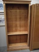 A pine bookcase (missing some shelf clips)