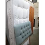 A single divan bad base with mattress and headboard