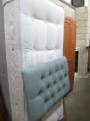 A single divan bad base with mattress and headboard