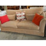 A large 3 seater sofa.