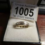 A white stone set eternity ring in 9ct gold, dated Birmingham 1973.