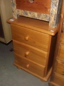 A pine 3 drawer bedside chest