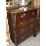 A 1930s 4 drawer oak bedroom chets of drawers