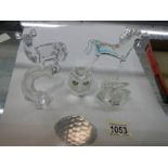 A quantity of glass animals including deer and horse.