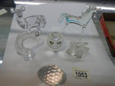 A quantity of glass animals including deer and horse.