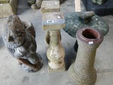 A concrete garden gnome, 2 pillars, mushroom and column.