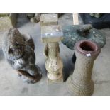 A concrete garden gnome, 2 pillars, mushroom and column.