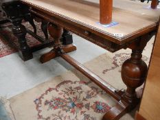 An early 20th century metamorphic oak table.