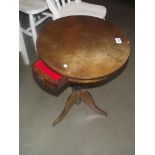 A round oak tripod side table with drawer