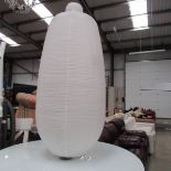 A large paper table lamp.
