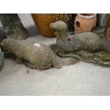 2 otter garden ornaments.