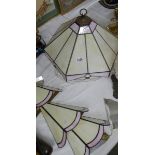 A leaded glass ceiling light and 3 matching wall lights.