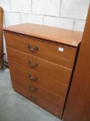 A wood effect bedroom chest of 5 drawers