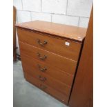 A wood effect bedroom chest of 5 drawers