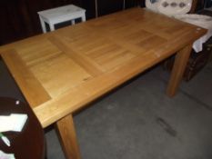 A modern solid oak dining table